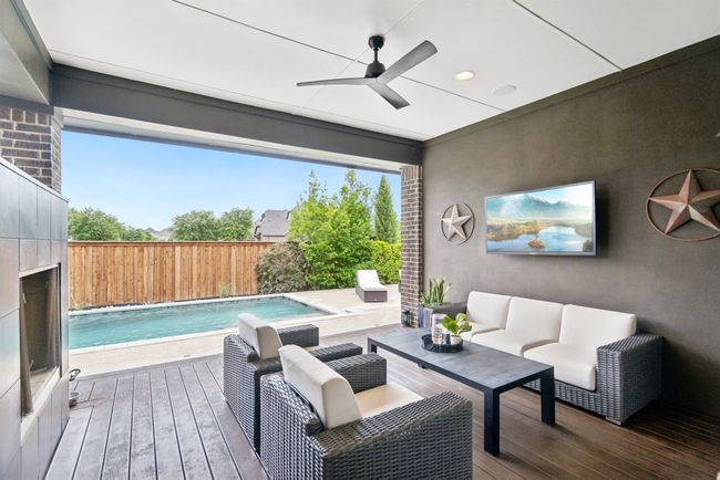 Wooden deck featuring ceiling fan and an outdoor hangout area | Image 27