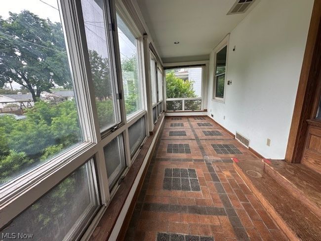 View of unfurnished sunroom | Image 6