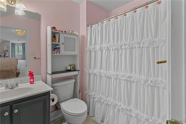 Full bath with toilet, a shower with curtain, and vanity | Image 36