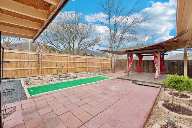 View of patio / terrace with a wooden deck and a fenced backyard | Image 22