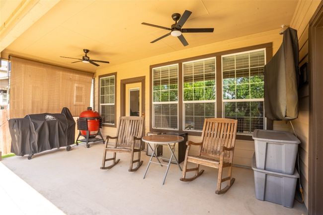 View of patio / terrace with a ceiling fan and area for grilling | Image 24