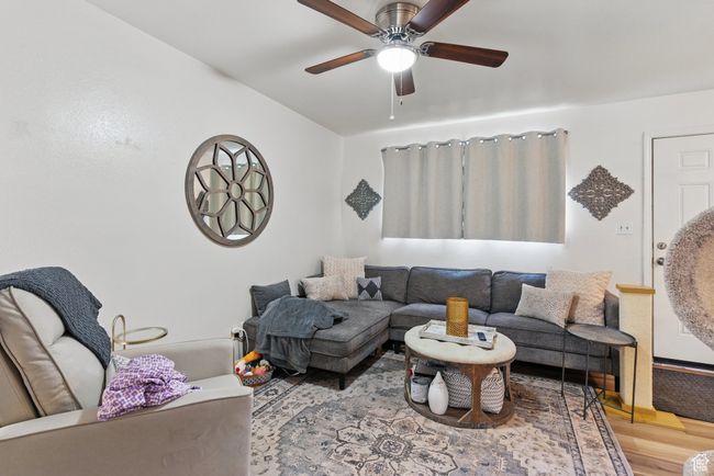 Living room featuring a ceiling fan and wood finished floors | Image 41