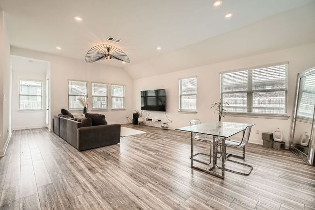 Living area featuring light wood finished floors and recessed lighting | Image 6