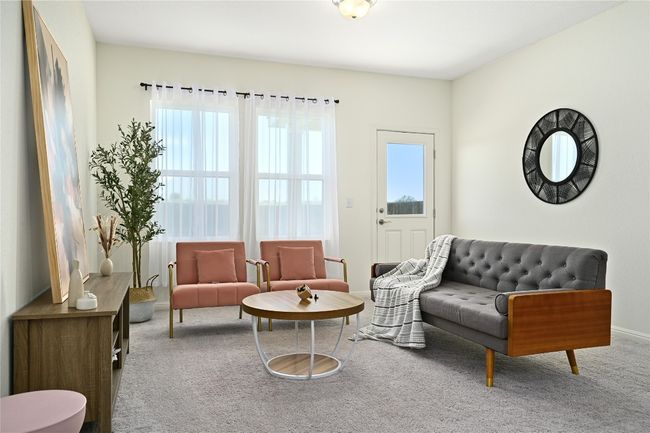 Living area featuring carpet, a healthy amount of sunlight, and baseboards | Image 12