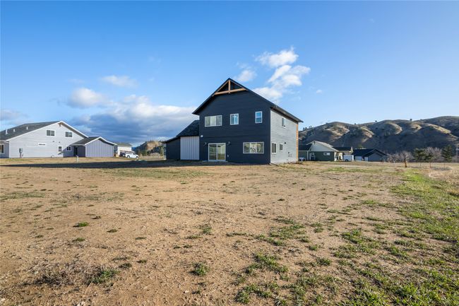 Rear view of house with a mountain view | Image 47