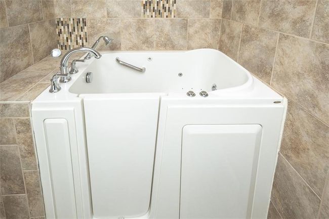 Bathroom featuring a whirlpool tub | Image 29