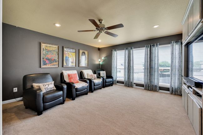 Living area featuring light carpet, a ceiling fan, and recessed lighting | Image 23