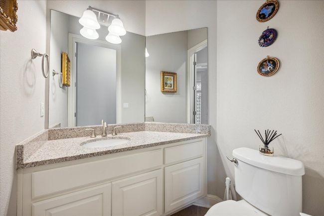 Bathroom featuring toilet and vanity | Image 32