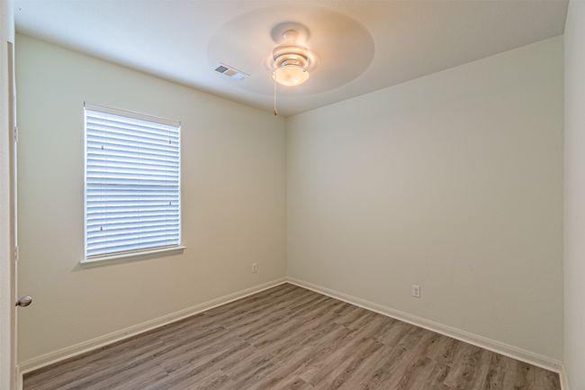 Empty room featuring light wood-style floors, a ceiling fan, and baseboards | Image 26