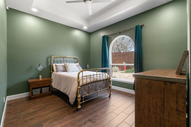 With its own ensuite bath, the guest bedroom provides both convenience and a touch of luxury, making it a welcoming space for guests to unwind in privacy | Image 22