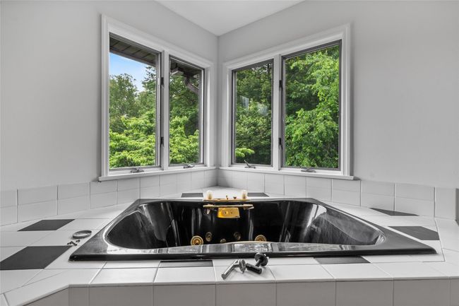Full bathroom featuring a tub with jets | Image 17