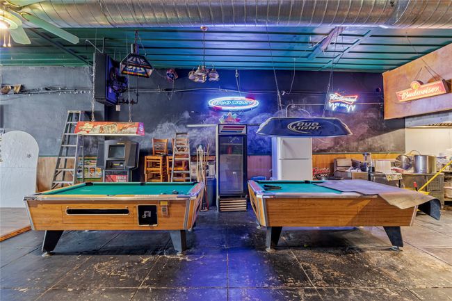Game room with ceiling fan and pool table | Image 12