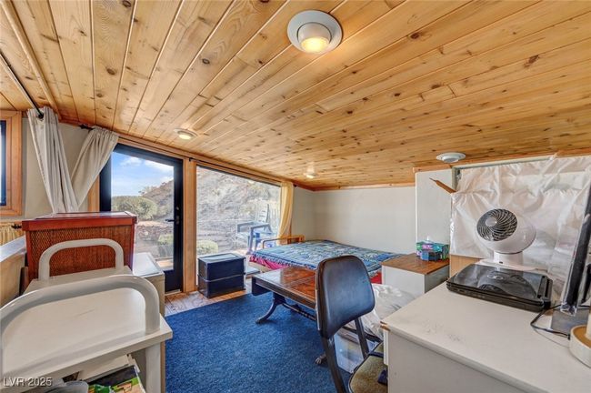 Bedroom featuring wooden ceiling | Image 35
