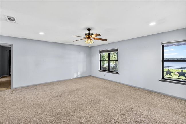 Carpeted spare room featuring ceiling fan and recessed lighting | Image 28