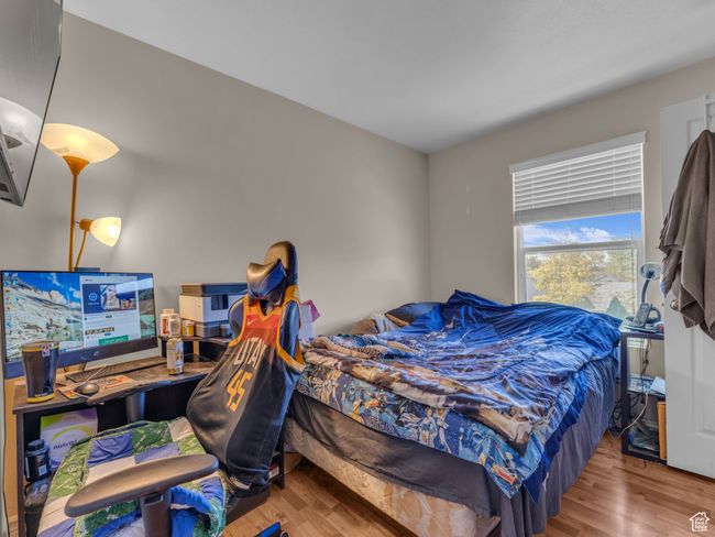 Bedroom featuring wood finished floors | Image 32