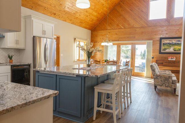 View past kitchen to outdoor patio | Image 10