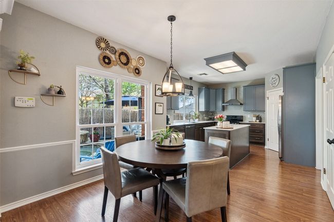 Dining room featuring baseboards and wood finished floors | Image 17