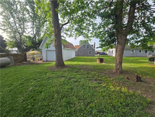 View of yard featuring an outbuilding and an exterior structure | Image 28