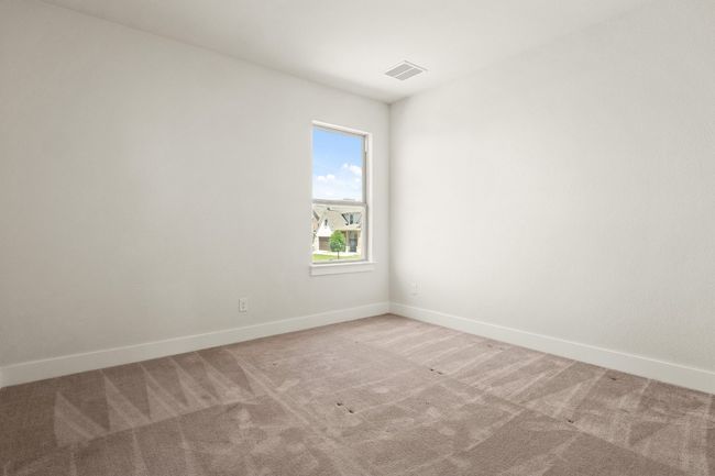 Carpeted spare room with baseboards and visible vents | Image 23