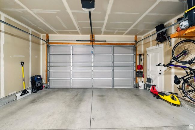 Garage featuring a garage door opener | Image 20