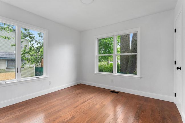 Unfurnished room featuring baseboards and plenty of natural light | Image 8