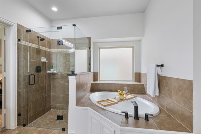 Full bathroom with a shower stall and a garden tub | Image 21