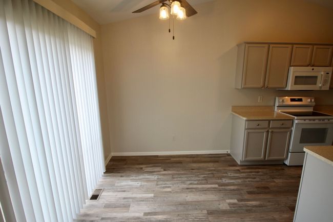 Dining area w/ patio view. New lights/ | Image 20
