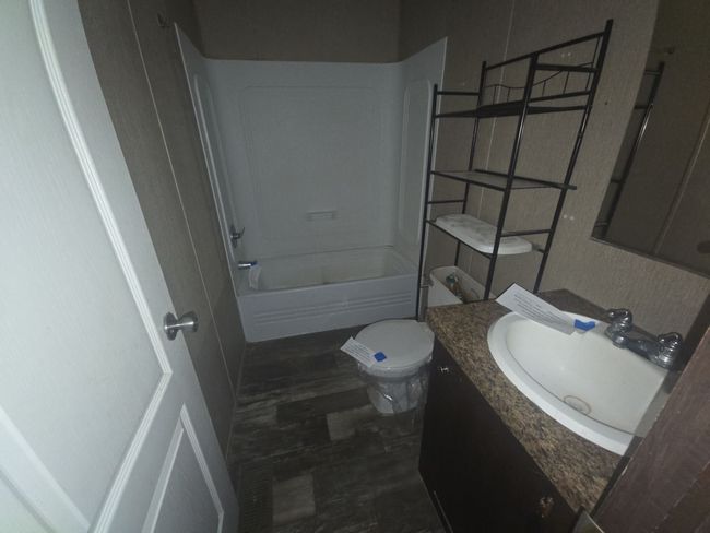 Full bath featuring toilet, vanity, and shower / bath combination | Image 22