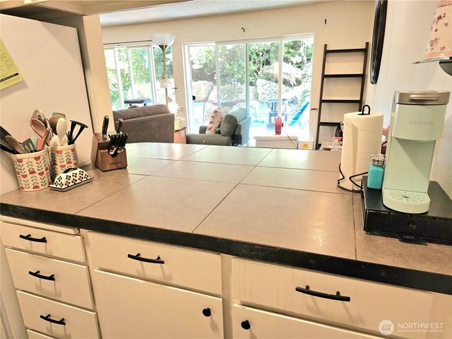 The counterspace allows access to the additional dining area. | Image 9