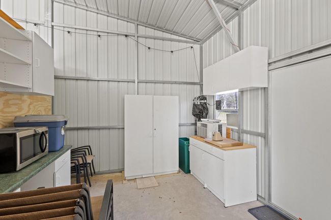 Garage featuring metal wall | Image 13