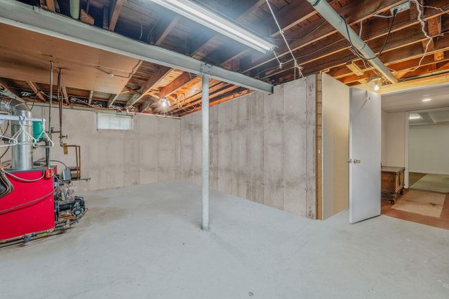 Basement featuring a heating unit | Image 27
