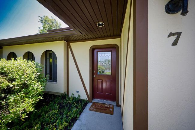 Entrance to property featuring stucco siding | Image 32