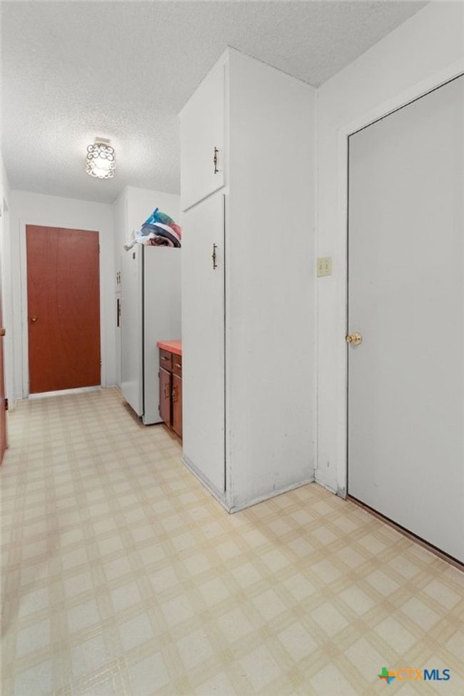 Hallway to utility room and half bath | Image 24
