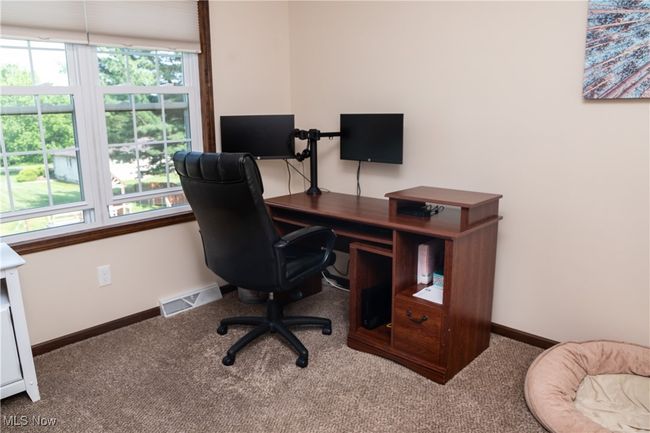 Carpeted bedroom space with baseboards | Image 39