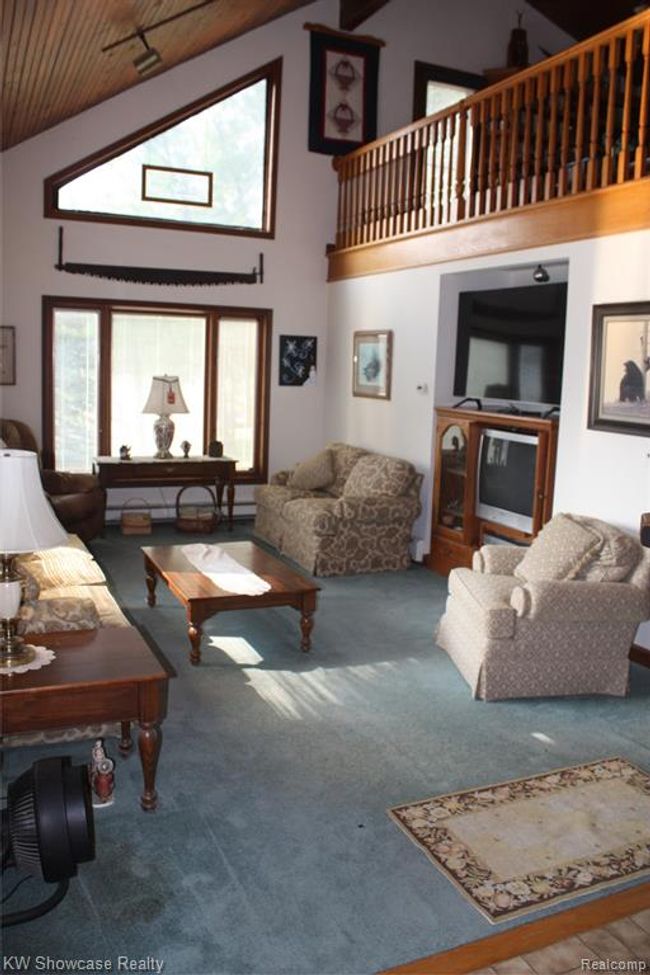 Living room, with loft above. | Image 18