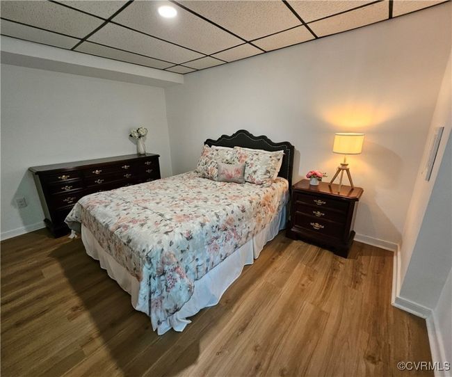 Finished basement featuring a drop ceiling, carpet floors, and stairway-spacious for game room or flexible living area as needed | Image 40