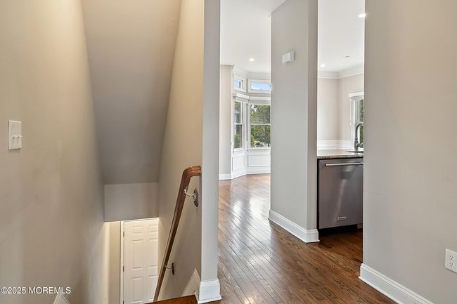 2nd level facing into kitchen/dining area | Image 11
