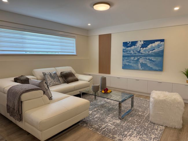Living area with wood finished floors and recessed lighting | Image 4
