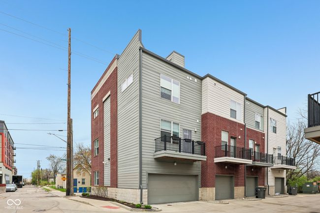 exterior space with central AC, driveway, and a garage | Image 24