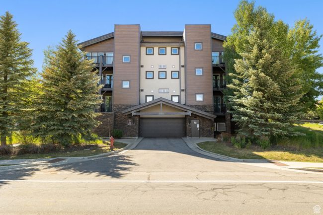 View of property featuring concrete driveway | Image 34