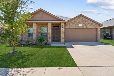 View of front of property with a garage and a front lawn | Image 2