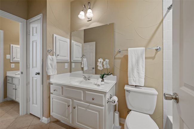 Full bath with vanity and tile patterned floors | Image 33