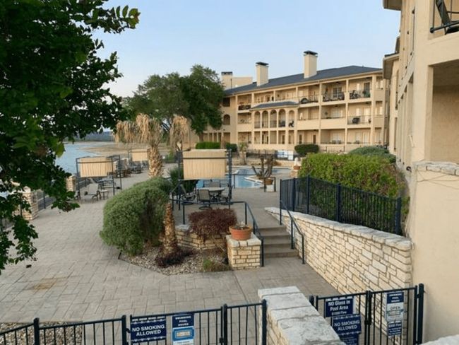 View of property with a community pool | Image 21