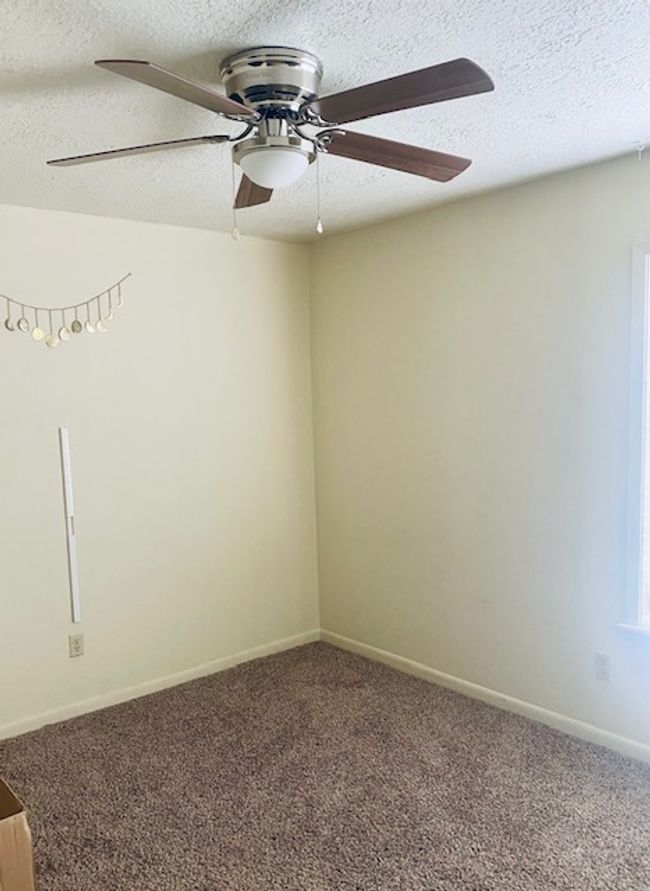 Carpeted spare room featuring baseboards and a textured ceiling | Image 12