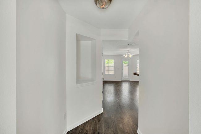 Welcoming foyer with a special nook! Fresh paint throughout the entire home creates a clean but warm feel to your home | Image 5