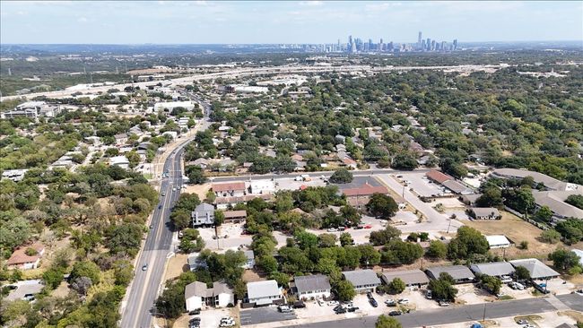Aerial view of property's location featuring city skyline and a highway | Image 21