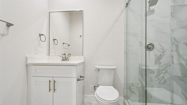 Full bath featuring a marble finish shower and vanity | Image 25
