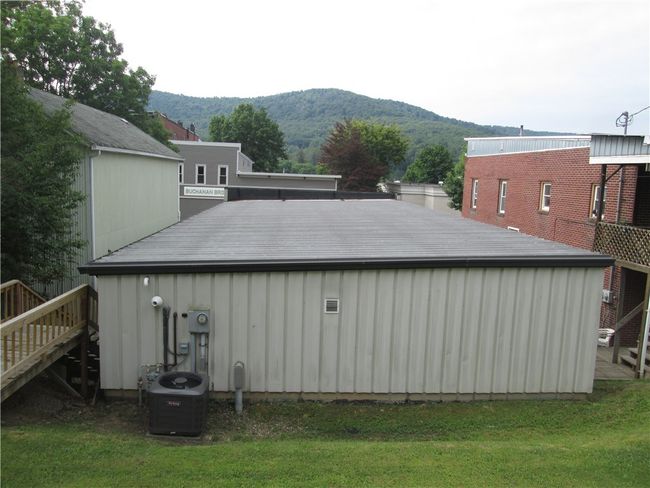 Rear of property with sloped roofing | Image 33