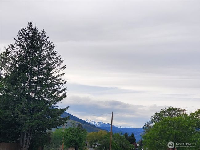 Snow capped peaks due West in distance from Driveway off of Twisp River River Road. | Image 40