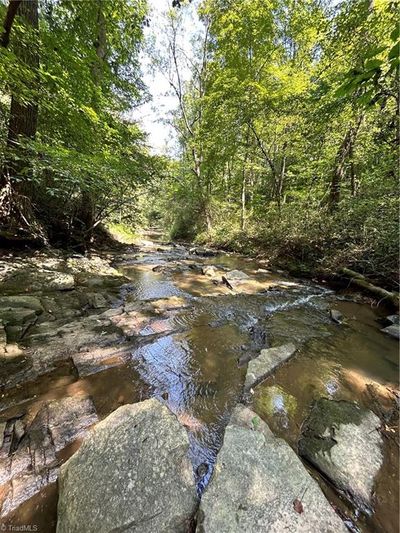 The beautiful creek at the base of the property. | Image 1